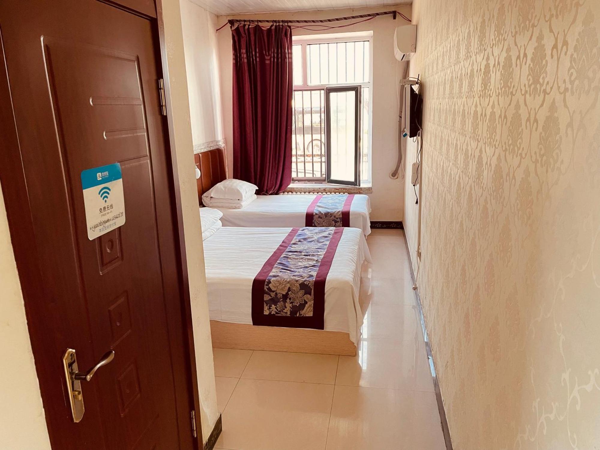哈尔滨机场东方红运宾馆 Hotel Стая снимка