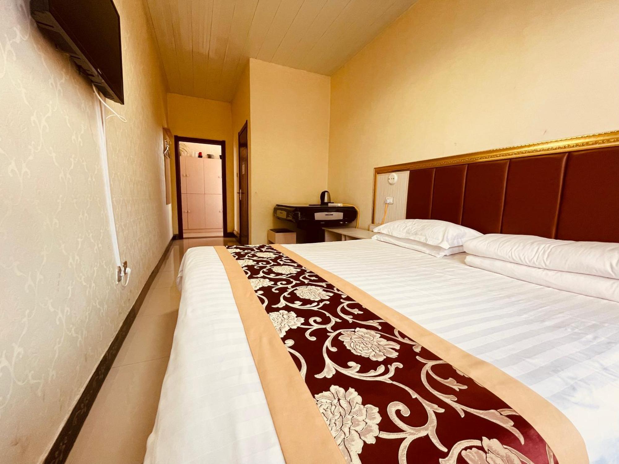 哈尔滨机场东方红运宾馆 Hotel Стая снимка